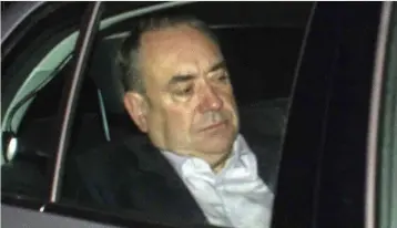  ??  ?? Face of defeat: The iconic picture of a dejected Alex Salmond at Aberdeen Airport