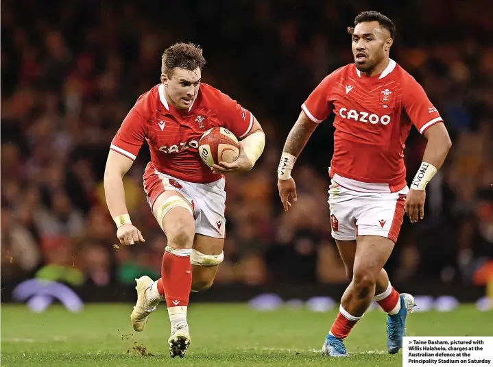  ?? ?? > Taine Basham, pictured with Willis Halaholo, charges at the Australian defence at the Principali­ty Stadium on Saturday