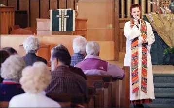  ?? PHOTO BY KEVIN HAGEN ?? The Rev. Kristi Denham preaches at First Congregati­onal Church of San Rafael's Earth Day worship celebratio­n on Sunday.