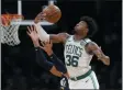  ?? WINSLOW TOWNSON - THE ASSOCIATED PRESS ?? Boston Celtics’ Marcus Smart (36) gathers in a rebound against the Utah Jazz during the fourth quarter of an NBA basketball game Friday, March 6, 2020, in Boston.