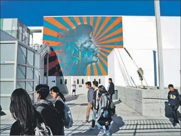  ?? Kirk McKoy Los Angeles Times ?? THE L.A. SCHOOL district will paint over the Robert F. Kennedy Community Schools mural after Korean groups said the sun rays resemble the Japanese imperial battle f lag, a symbol compared to the swastika.