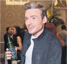  ?? JEROD HARRIS GETTY IMAGES FOR HEINEKEN ?? Richard Madden, Robb from Game of Thrones, drinks a Heineken 0.0. Heineken sold 7.7 per cent more beer last year.