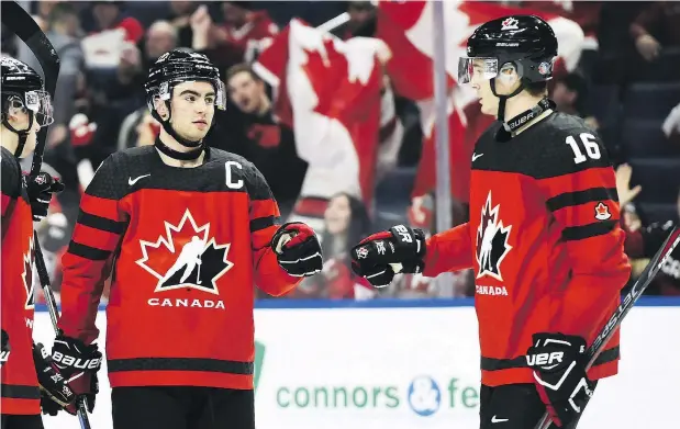  ?? — THE CANADIAN PRESS FILES ?? When Dillon Dube, left, and Taylor Raddysh suited up in last year’s World Junior Championsh­ips quarter-final against Switzerlan­d in Buffalo Jan. 2, on 5,533 fans showed up for the game, but organizers of this year’s world juniors in B.C. expect much better turnouts.