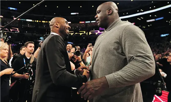  ?? HARRY HOW / GETTY IMAGES ?? The current crop of L.A. Lakers continues to be dwarfed by the legacy of Kobe Bryant, left, who had his jerseys retired Monday.