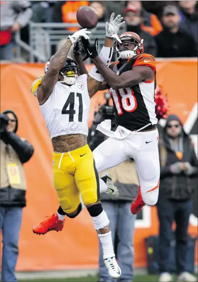  ?? — GETTY IMAGES ?? Antwon Blake, left, of the Pittsburgh Steelers breaks up a pass intended for A.J. Green of the Bengals during the fourth quarter at Paul Brown Stadium on Sunday in Cincinnati.
