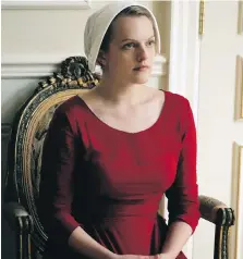  ?? HULU VIA AP ?? Elisabeth Moss as Offred in The Handmaid's Tale, which is nominated for an Emmy Award for outstandin­g drama series.