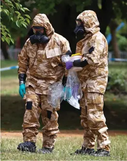  ??  ?? Search: Police officers in a park in Salisbury on Wednesday