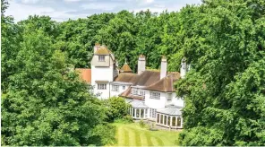  ??  ?? Leafy: Galewood House near Cambridge is on the market at £1.65 million