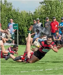  ?? LAURAN ROBINSON ?? Zac Guildford goes to ground on his Hamilton Old Boys debut against Melville.