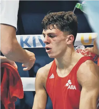  ?? ?? Final agony: Washington fighter Pat McCormack contemplat­es his defeat in the European Championsh­ips final in Ukraine on Saturday. Pat and brother Luke both lost their gold-medal showdowns. Analysis on page 19.