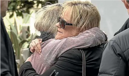  ?? KEVIN STENT/STUFF ?? Yvonne Tolley, the aunt of Lois Tolley, is comforted outside the Hutt Valley District Court yesterday.