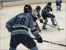  ?? ANDREW ROBINSON/MEDIANEWS GROUP ?? North Penn’s Ryan Cunningham (47) and Zachery Cline (66) trap a Souderton skater earlier this season.