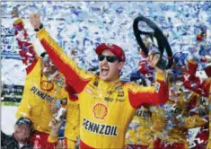  ?? STEVE HELBER — THE ASSOCIATED PRESS ?? Joey Logano celebrates after winning the Monster Energy NASCAR Cup Series auto race at Martinsvil­le Speedway in Martinsvil­le, Va., Sunday.