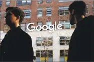  ?? Associated Press ?? People walk by Google offices in New York. A week after high-paid engineers and others walked out in protest over its male-dominated culture, Google is promising to be more forceful and open about its handling of sexual misconduct cases.