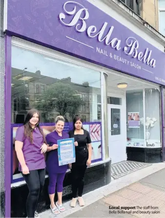  ??  ?? Local support The staff from Bella Bella nail and beauty salon
Serving up a bargain Staff from Cafe Fairfull with the poster