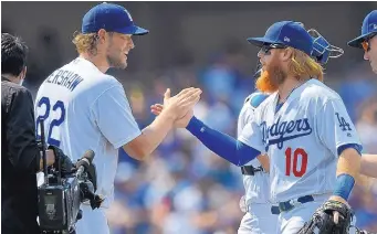  ?? MARK J. TERRILL/ASSOCIATED PRESS ?? Dodgers pitcher Clayton Kershaw, left, and third baseman Just Turner (10) are two of the reasons Los Angeles has high hopes for the rest of the 2017 season.