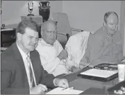  ?? Doug Walker / RN-T ?? Ryan Earnest (from left) is chosen to serve as treasurer of the Developmen­t Authority of Floyd County on Wednesday. DAFC member Larry Morrow and Floyd County Manager Jamie McCord were also among those present for the first meeting of the authority this...