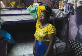  ?? AP PHOTO/ BRAM JANSSEN ?? Margaret Oliele, former detained patient, poses for a portrait in her home in Nairobi, Kenya. During a botched cesarean section in 2010, doctors left a pair of surgical scissors inside her stomach; a second surgery was needed to remove the scissors and she later suffered a ruptured bladder and a blood infection. When she couldn’t pay her hospital fees, Oliele was taken to a detention ward.