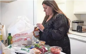  ?? ALLISON DINNER/AP ?? Jacqueline Benitez, 21, a preschool teacher, depends on California’s SNAP benefits to help pay for food, and starting in March she expects a significan­t cut to the food benefits she has received since 2020.