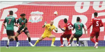  ?? — AFP photo ?? Sadio Mane (third right) scores the opening goal during the English Premier League match between Liverpool and Aston Villa at Anfield in Liverpool, north west England.