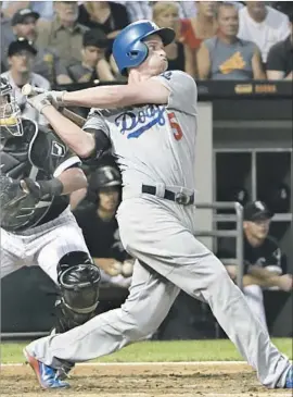  ?? David Banks Getty Images ?? COREY SEAGER hits a two-run home run in the fourth inning of the Dodgers’ 9-1 rain-shortened victory over the host Chicago White Sox.