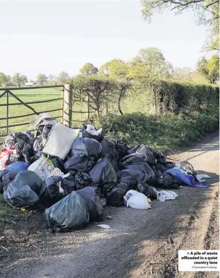  ?? Christophe­r Furlong ?? A pile of waste offloaded in a quiet country lane