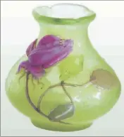  ??  ?? Emile Gallé (     -     ) . Vase ( H :   cm) Rose de France, vers     , en terre multicouch­e vert pâle à décor appliqué à chaud, sculpté à la meule et à la roue. Estimation :   -   euros.