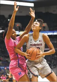  ?? Jessica Hill / Associated Press ?? UConn’s Olivia Nelson-Ododa posts up against Memphis’ Brianna Porter on Wednesday night in Hartford.