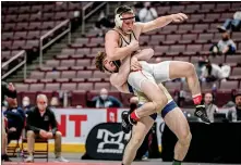  ?? NATE HECKENBERG­ER - FOR MEDIANEWS GROUP ?? Spring-Ford’s Jack McGill lifts Northampto­n’s Jagger Condomitti for a takedown in the 160-pound finals.