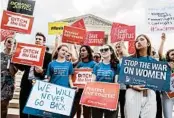  ?? J. SCOTT APPLEWHITE/AP ?? Activists rally Thursday at the Supreme Court as the president prepares to choose a replacemen­t for Anthony Kennedy.