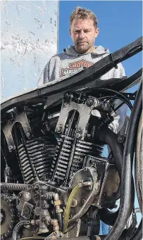  ??  ?? David Buttler, from the Gold Coast, checks out some of the details on Burt Munro’s recordbrea­king bike.