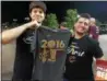  ?? MARK PODOLSKI — THE NEWS-HERALD ?? Mentor residents Bill Owen, left, and Brett Pfeifer show off a Cavs NBA championsh­ip T-shirt June 19, 2016, at Dick’s Sporting Goods in Mentor.