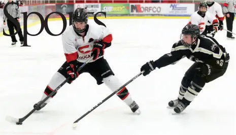  ?? CITIZEN PHOTO BY JAMES DOYLE ?? Landon Kitchen of the Coast Inn of the North Cougars goes wide around the outstretch­ed stick of Dawson Wolf of the Chilliwack Bruins on Wednesday at Kin 1. The two teams met in the B.C. Hockey midget Tier 1 provincial championsh­ip.