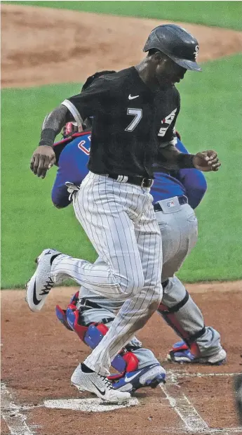  ?? JONATHAN DANIEL/GETTY IMAGES ?? White Sox shortstop Tim Anderson (shown scoring in the first inning of an exhibition game Monday against the Cubs) led the major leagues with a .335 batting average last season.