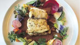  ?? PETER HUM ?? The red snapper at Xochi has a luxurious red chili sauce and vegetables.