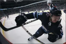  ?? THE CANADIAN PRESS/TREVOR HAGAN ?? Arizona Coyotes' Jakob Chychrun (6) hits Winnipeg Jets' Marko Dano (56) into the boards during second period NHL hockey action in Winnipeg, Tuesday.