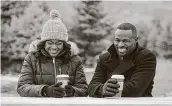  ?? Lifetime ?? Tatyana Ali, left, and Sean Patrick Thomas appear in the Lifetime holiday movie, “Christmas Hotel.”