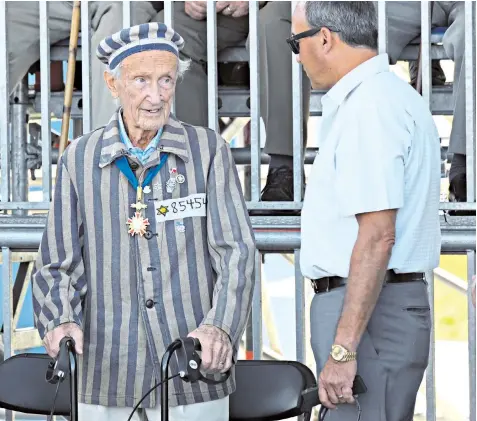  ??  ?? A concentrat­ion camp survivor attends a ceremony in Warsaw, Poland, yesterday to commemorat­e the 80th anniversar­y of the outbreak of the Second World War