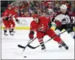  ?? KARL B DEBLAKER — THE ASSOCIATED PRESS FILE ?? In this file photo, Carolina Hurricanes’ Jeff Skinner (53) stretches for the puck with Colorado Avalanche’s Matt Nieto (83) defending during the second period of an NHL hockey game in Raleigh, N.C.