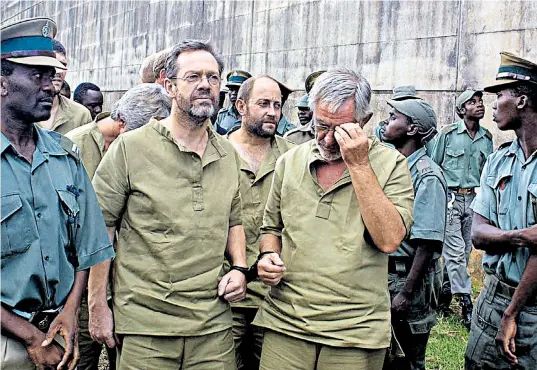  ??  ?? Failed coup: Simon Mann, left, the leader of a group of foreigners arrested in 2004 in Zimbabwe for trying to topple the head of Equatorial Guinea