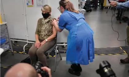  ?? Photograph: Jacob King/EPA ?? A woman receives her Covid-19 vaccine at an NHS centre in Birmingham. Under-16s are not eligible as current vaccines have not been licensed for minors