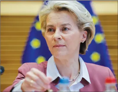  ?? Photo/Pool/AP/Olivier Matthys) ?? President of the European Commission Ursula von der Leyen rings the bell Wednesday during a meeting of the College of Commission­ers at EU headquarte­rs in Brussels.
(File