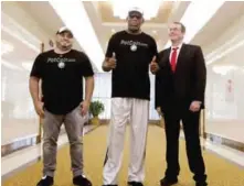  ?? — AFP ?? PYONGYANG: Former NBA basketball star Dennis Rodman (center) poses with his entourage upon arrival at Sunan Internatio­nal Airport yesterday.