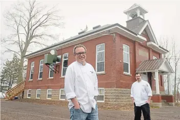  ?? DAVID BEBEE WATERLOO REGION RECORD ?? 1909 Culinary Academy executive chef, owner and instructor Murray Zehr, left, with sous chef Matt Power, restored a schoolhous­e that houses the business. The restoratio­n of the building and grounds has been a labour of love which culminated in the official opening in February. 1909 had to close in March for an undetermin­ed time due to the outbreak of COVID-19.