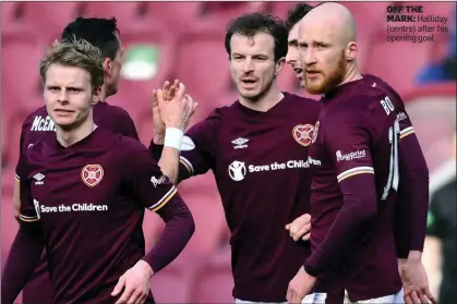  ??  ?? OFF THE MARK: Halliday (centre) after his opening goal