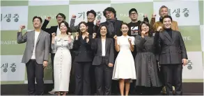  ??  ?? Bong (back row, third from right) and the cast of Parasite during their homecoming in Seoul. – REUTERS