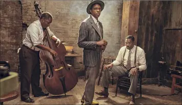  ?? David Lee / Netflix via AP ?? Michael Potts, from left, Chadwick Boseman and Colman Domingo in “Ma Rainey’s Black Bottom.” The film was not nominated for a Golden Globe in the best picture category.