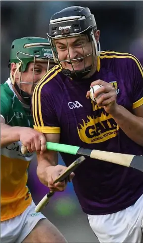  ??  ?? Jack O’Connor breaking through the challenge from Offaly captain David King.