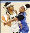  ??  ?? Chicago Sky guard Diamond DeShields, (left), tries to pass around Connecticu­t Sun guard/ forward Kaila Charles (3) during a WNBA basketball game, on June 19, in Chicago. (AP)