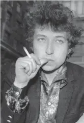  ?? AP ?? Musician Bob Dylan appears in London on April 27, 1965. Transcript­s of lost 1971 Dylan interviews with the late American blues artist Tony Glover and letters the two exchanged reveal that Dylan changed his name from Robert Zimmerman because he worried about anti-semitism, and that he wrote “Lay Lady Lay” for actress Barbra Streisand. The items are among a trove of Dylan archives being auctioned in November 2020, by Boston-based R.R. Auction.